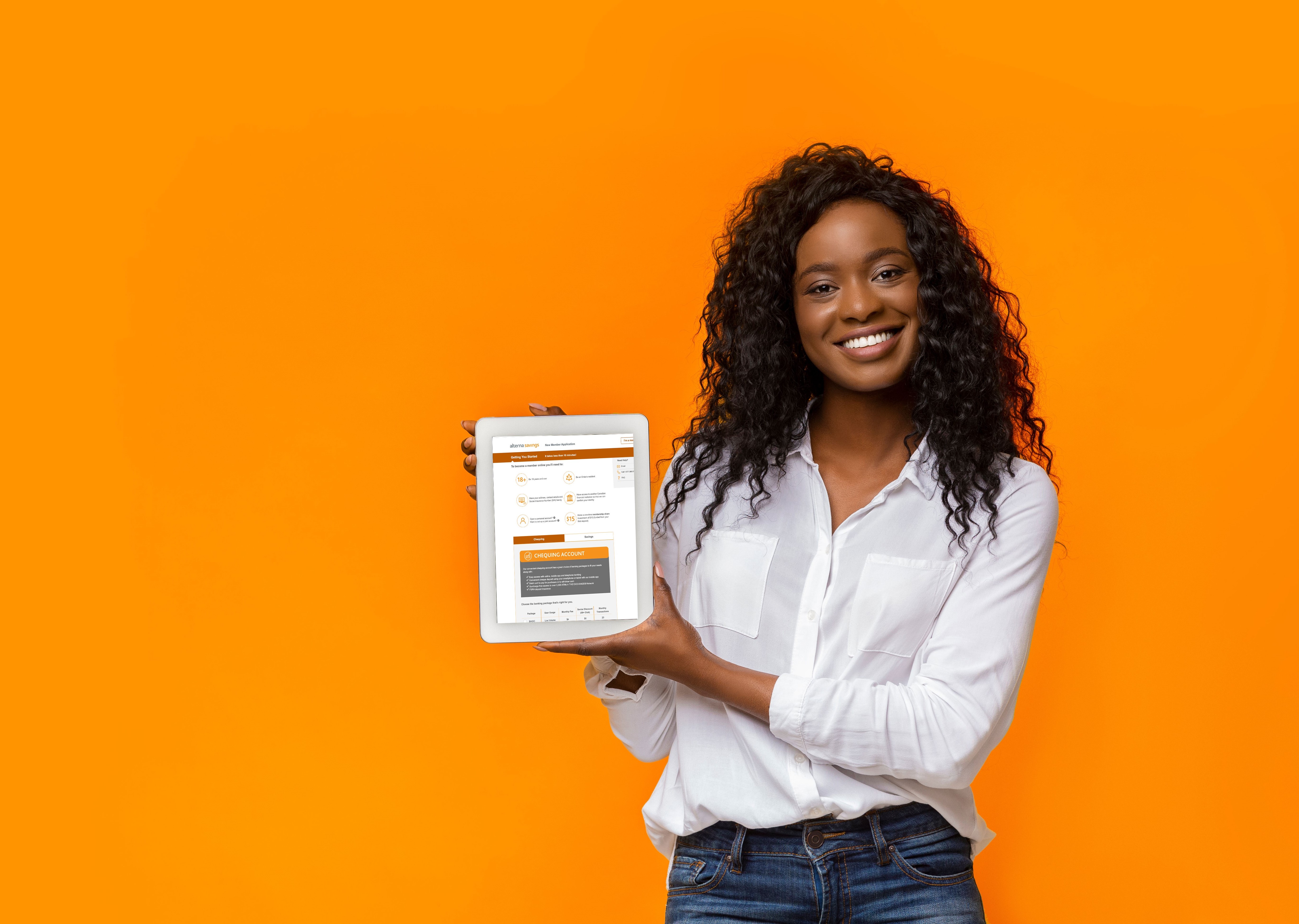 Smiling black woman with a tablet
